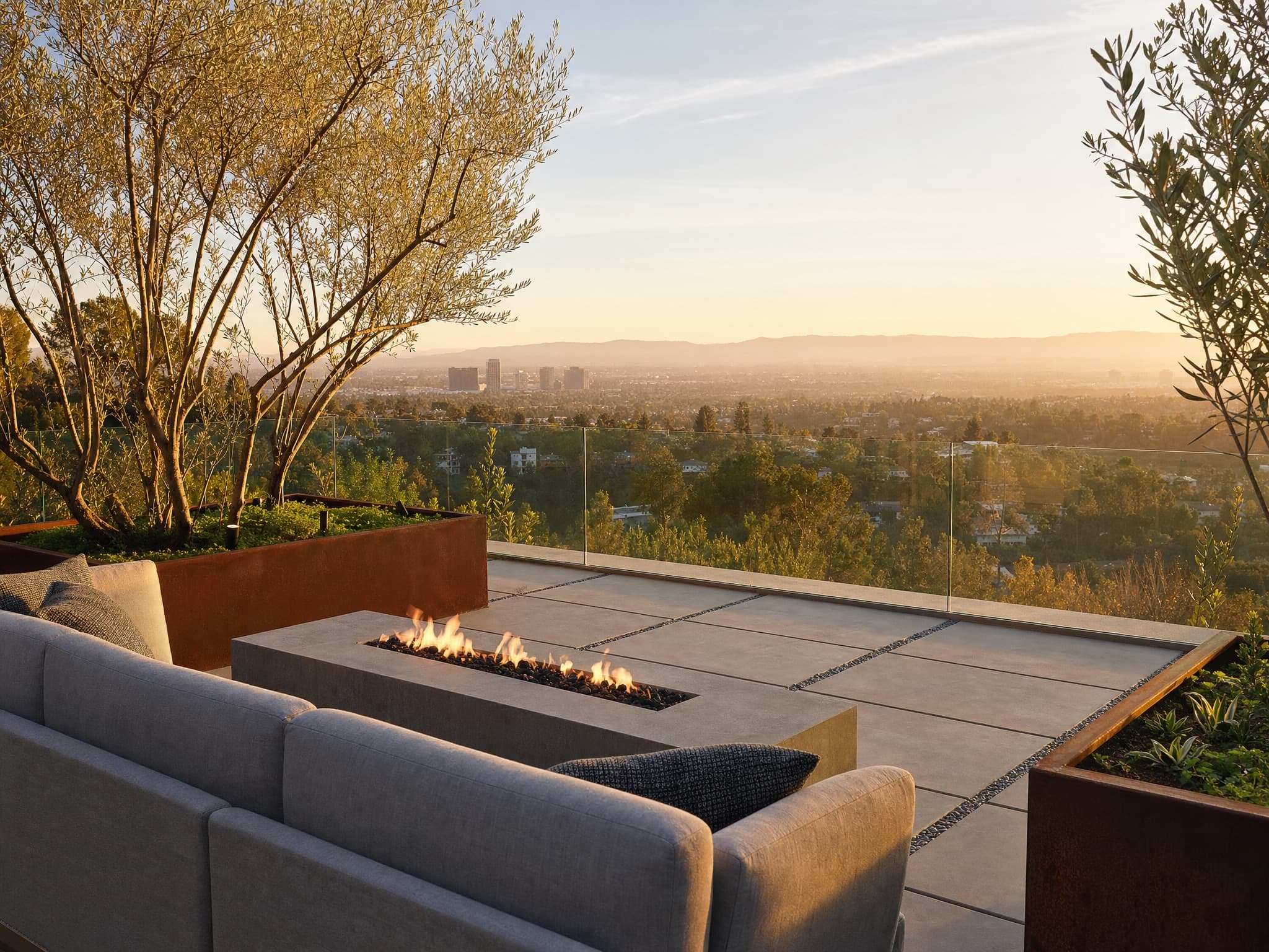 Hillside terrace in Studio City with linear fire feature and sweeping valley views at sunset